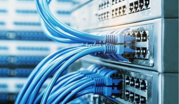 Several cables are plugged into machines